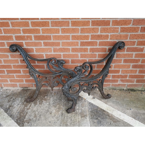 618 - A Victorian pair of cast iron garden bench ends with griffin terminals
