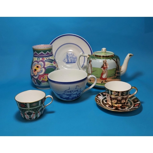 210 - A Poole vase; a selection of decorative teapots; other china