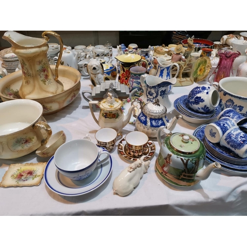 210 - A Poole vase; a selection of decorative teapots; other china