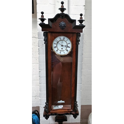 438 - A 19th century Vienna walnut wall clock with ebonised mouldings and single weight driven movement