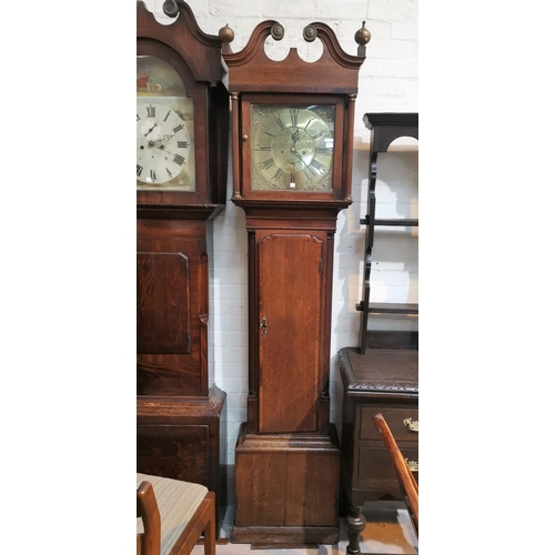 562 - An 18th century crossbanded oak longcase clock, with swan neck pediment and reeded columns to the ho... 