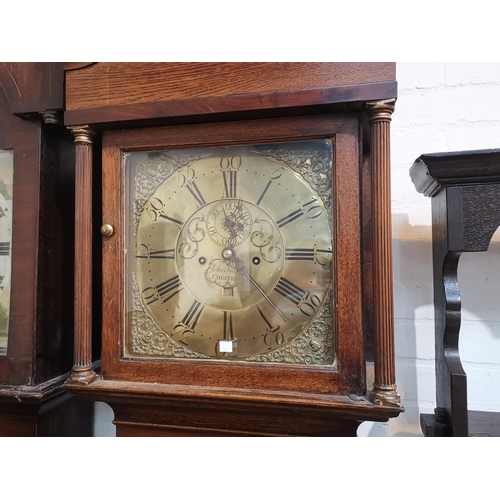 562 - An 18th century crossbanded oak longcase clock, with swan neck pediment and reeded columns to the ho... 