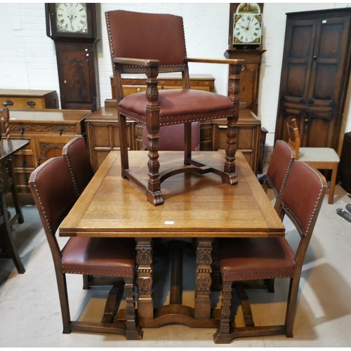 570 - A 1930's Jacobean style carved golden oak dining suite on square carved legs, comprising draw leaf t... 