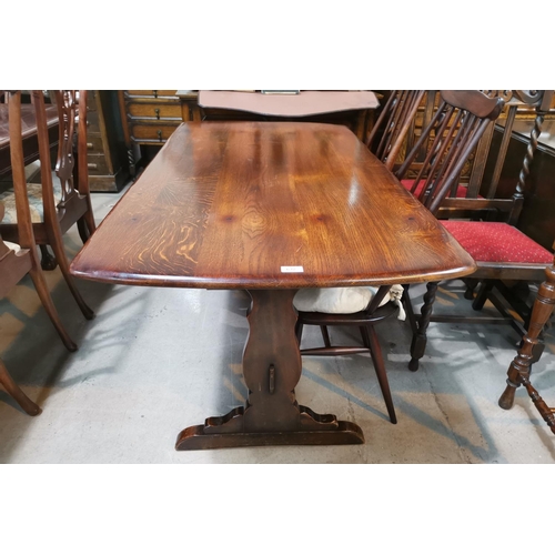 632 - An Ercol refectory style dining table with stretcher base, 144 cm x 76 cm