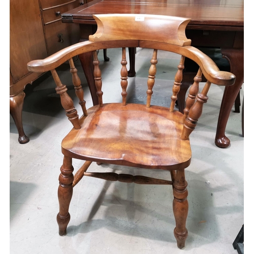 642 - A late 19th century elm and beech smoker's bow armchair