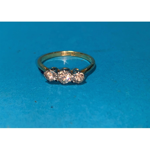 384 - A 1930's 18 carat gold dress ring set 3 diamonds