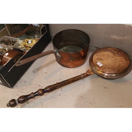 439 - A large copper sauce pan; a copper warming pan
