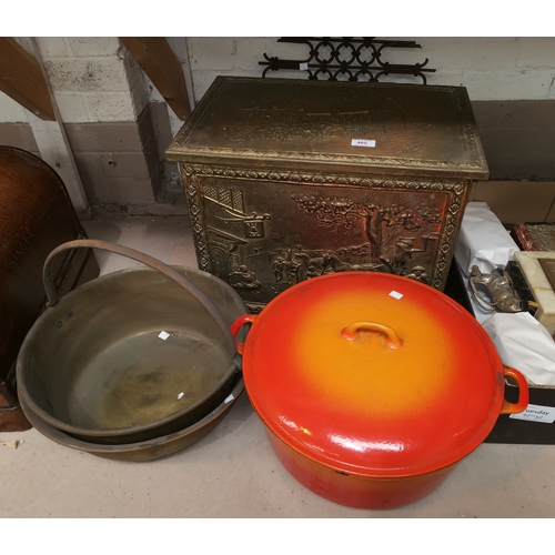 485 - An embossed brass log box; 2 brass jam pans; a large le Creuset casserole dish; etc.