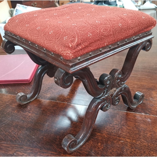 531 - A 19th century mahogany 'X' framed stool on knurled supports
