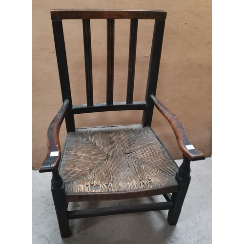 549 - A Georgian child's country stained wood chair with rail back