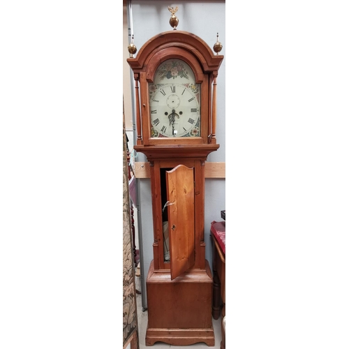 561a - A 19th century longcase clock, the arch top hood with turned pillars and brass finials, quarter reed... 
