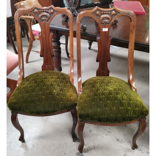 569 - A set of 4 Edwardian carved walnut dining chairs