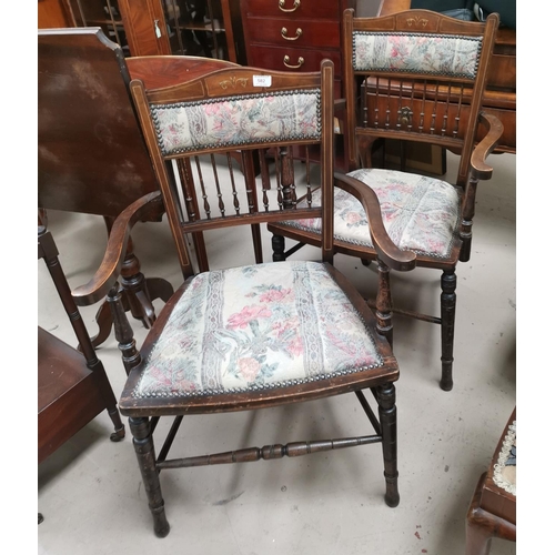 582 - A pair of Edwardian inlaid spindle back dining chairs