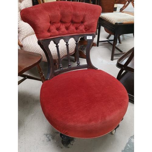 588 - A Victorian low seat nursing chair in rust coloured upholstery