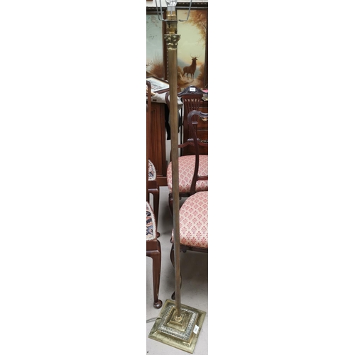 590 - An Edwardian brass standard lamp with reeded column