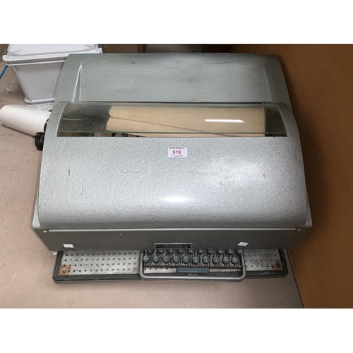 519 - A vintage teleprinter with keyboard and GPO logo to cover with some original documents