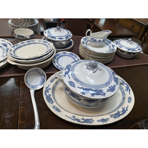 239 - A Booths Dragon pattern blue and white part dinner service; A 1920’S WHITE PAINTED WOVEN CANE ARMCHA... 
