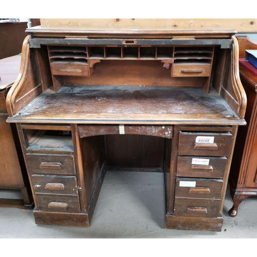 643 - An 'S' roll top twin pedestal desk, vintage oak finish, 48