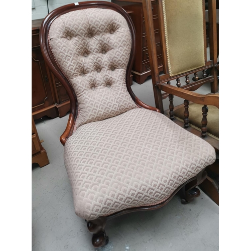 597 - A 19th century mahogany spoon back nursing chair in pink dralon