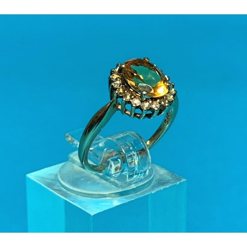 196A - A Ladies 9ct hall marked gold dress ring set with a central oval facetted citrine coloured stone
sur... 