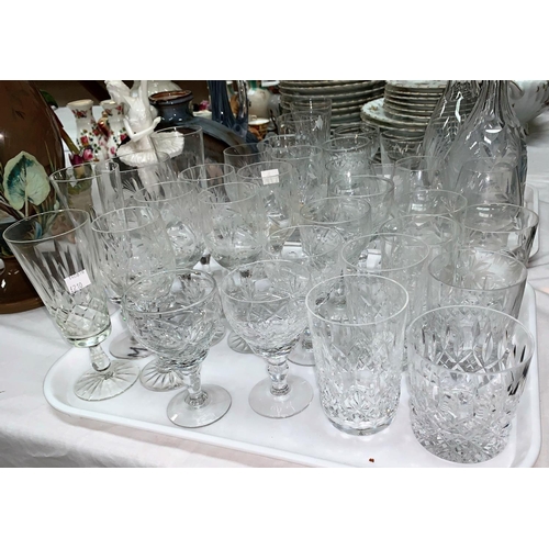 210 - A selection of various cut glass drinking glasses; a decanter with silver rim and another decanter