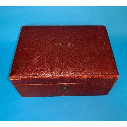 330A - An Edwardian brown leather jewellery box by Finnigans, Manchester with gilt monogram,
hinged lid and... 