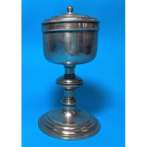 333 - A silver covered chalice with rope twist borders, on turned knopped column and circular base, London... 