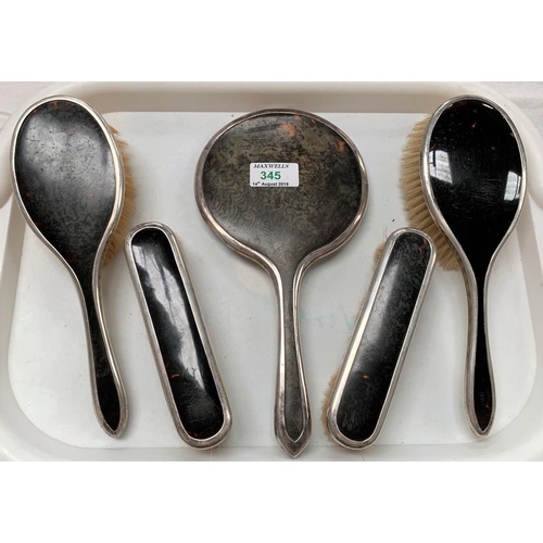 345 - A 5 piece dressing table set with silver and tortoiseshell backs; a cased part manicure set