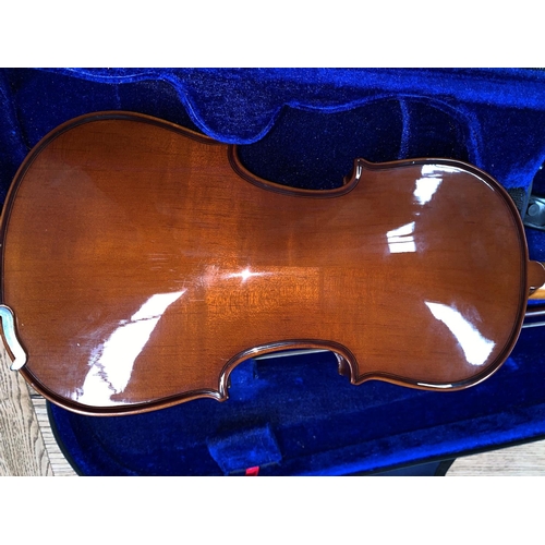 347a - A STENTOR half size violin with two piece back 31cm with natural wood bow, plush fitted
case.