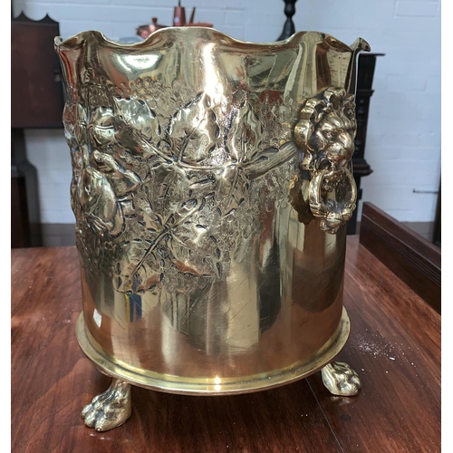 407A - A WW1 “Trench Art” jardinière with lion mask and ring handles, relief trailing flower and
leaf decor... 