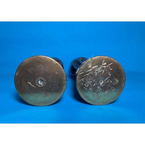 422A - A pair of WW1 Trench Art vases formed from brass shell cases, with crenelated rim,
embossed band and... 