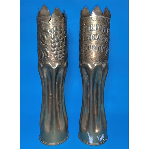 422A - A pair of WW1 Trench Art vases formed from brass shell cases, with crenelated rim,
embossed band and... 