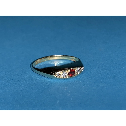439A - A hallmarked gypsy style ring inset with 4 small clear and one ruby colour stones,
Chester 1919, 1.8... 