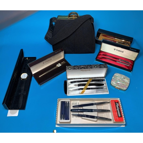 459 - A Parker gold plated ballpoint pen, cased; other pen sets; a 1950's handbag; a mother-of-pearl cover... 