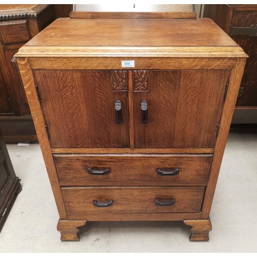509 - A 1930's oak tallboy with double cupboard and 2 drawers