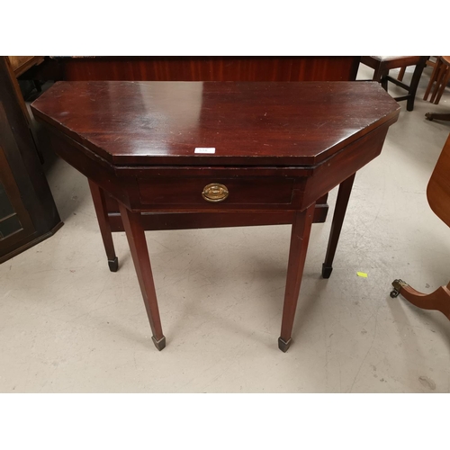 518 - A 19th century canted rectangular fold over card table with frieze drawer and square tapering legs