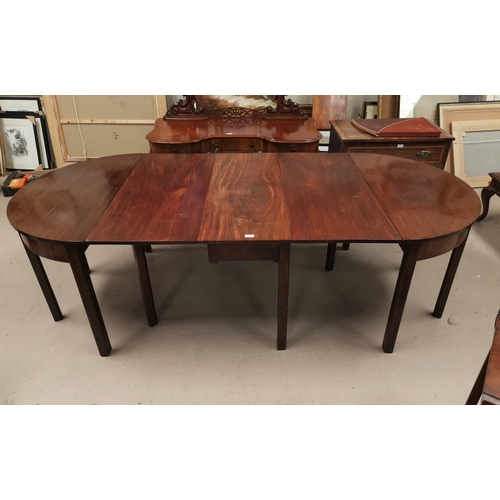519 - A Georgian mahogany extending dining table on square legs comprising a pair of demi-lune side / end ... 
