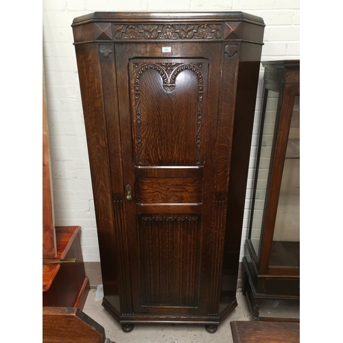 526 - A 19030's hall robe in carved canted oak