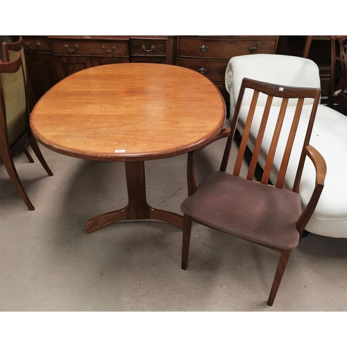 595 - A pair of G-Plan teak carver chairs with slat backs; A G-Plan teak extending dining table with shape... 