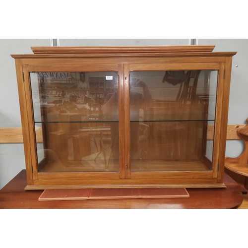 619 - A stained walnut display cabinet with 2 doors
