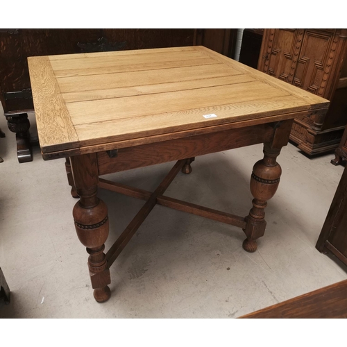 627 - A refinished golden oak draw leaf dining table on bulbous legs