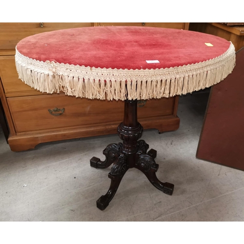 645 - A Victorian walnut occasional table on carved column and quatrefoil legs, velvet re-covered top