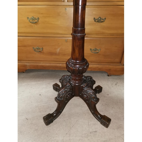 645 - A Victorian walnut occasional table on carved column and quatrefoil legs, velvet re-covered top
