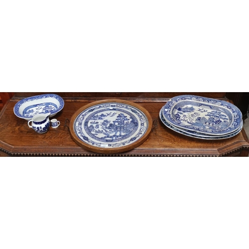 172 - Three 19th century blue & white meat plates; a similar dish and jug; a Willow pattern embroidered tr... 