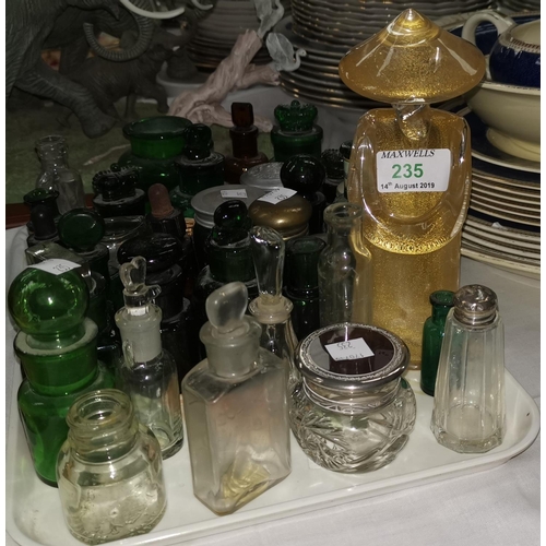 235 - A Murano figure of a Chinese man; a selection of 19th century green glass medicine and other bottles