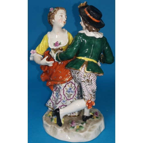 277 - A 19th century porcelain group in the Derby manor depicting a young man and woman in 18th century cl... 