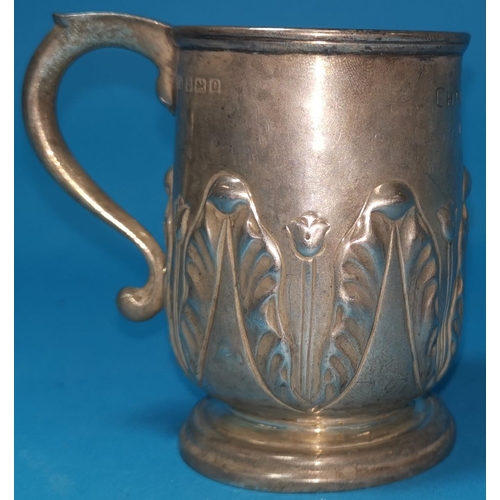 329 - A hallmarked silver christening mug with acanthus decoration, Birmingham 1938