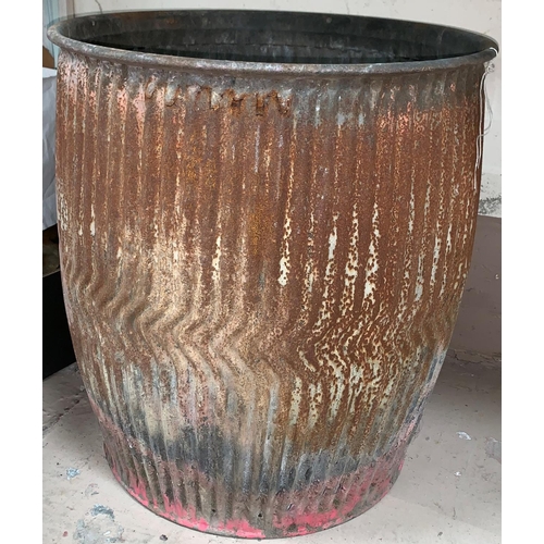 376A - A late 19th Century/ early 20th Century ribbed galvanised metal dolly tub, height 21” (some
rusting)