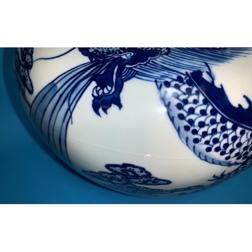 181 - A Chinese pair of globular vases with underglaze blue decoration of dragons, 12