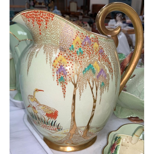 185 - A Carltonware Art Deco ovoid jug with jewelled and gilt decoration of storks and trees; a Carlton pa... 